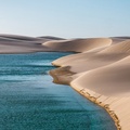 Pond among desert sand dunes